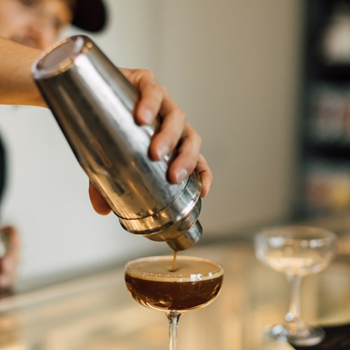 barista pouring an espresso martini