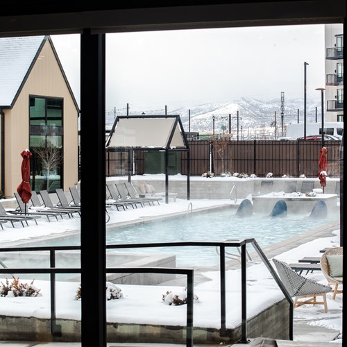 shot of the pool with snow covered sidewalks